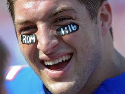 Tebow with Rom scrip