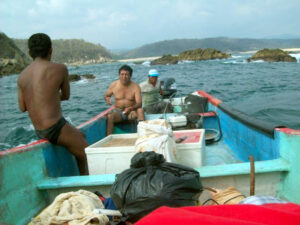 Pastor Damian (facing camera) lobster fishing