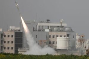 Missile from Iron Dome defense system launches to intercept missile fired from Gaza