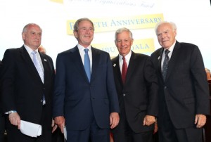 From left to right, Conference of Presidents Executive Vice Chairaman Malcolm Hoenlein, former U.S. President George W. Bush, Conference of Presidents Chaiman Robert G. Sugarman, and Conference of Presidents past chairman Melvin Salberg at the 50th anniversary tribute gala for the Conference of Presidents on Tuesday in New York. Credit: ©Michael Priest Photography.