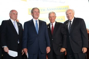 From left to right, Conference of Presidents Executive Vice Chairaman Malcolm Hoenlein, former U.S. President George W. Bush, Conference of Presidents Chaiman Robert G. Sugarman, and Conference of Presidents past chairman Melvin Salberg at the 50th anniversary tribute gala for the Conference of Presidents on Tuesday in New York. Credit: ©Michael Priest Photography. 