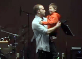 Joel holding Braxton
