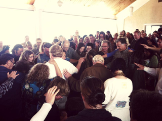 gathering in prayer at Church by the Sea