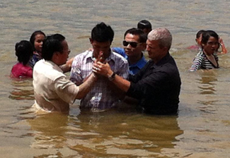 Paul conducting baptisms