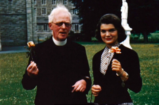 Jackie with Irish priest before her marriage