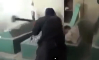 Hooded figure smashes tomb of Jonah
