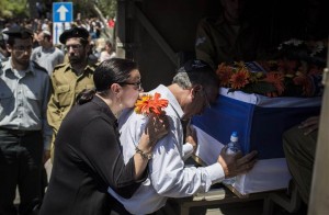 Max's parents, Stuart and Evie, saying their final goodbyes to their son