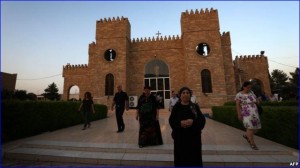 Iraqi Christians leave St. Joseph's Church after a mass in Irbil, the capital of the autonomous Kurdish region, on July 20