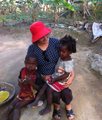 "I visited five little orphans left alone after their mother died. The older girl was hit by a motorcycle, has broken bones and is at a hospital an hour away. Her 8-year old sister stays with her at the hospital. The 9-yr old boy left, but no one knows where he is. The two youngest (pictured here) were left alone." -- Norma