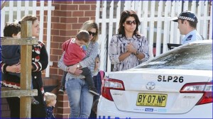 Police talk with parents outside Maronite College of the Holy Family in Parramatta, Sydney (photo: Cameron Richardson).