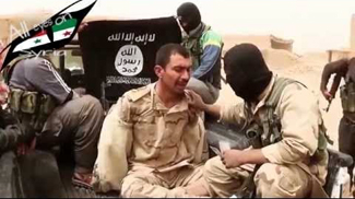 ISIS with captured Iraqi soldier