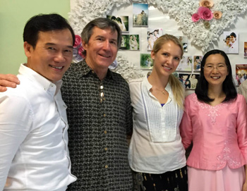 Pastor Khajorn (left) and his wife Gai (far right) meet with team visiting from California, Tom Ravensberg and Beka Farrar
