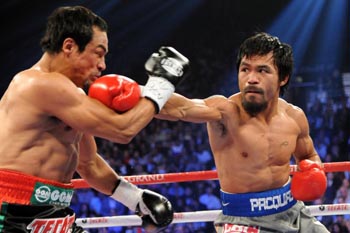 Dec 8, 2012; Las Vegas, NV; Manny and Juan Manuel Marquez box during their welterweight bout at the MGM Grand Garden Arena. Credit: Joe Camporeale-USA TODAY Sports