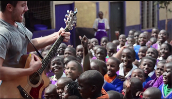 Doug playing with children