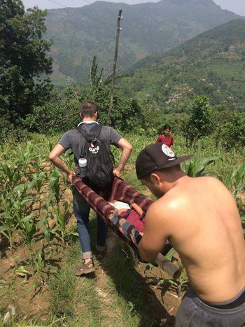 "One of the village girls was playing among the rubble and she split her leg open, so we built a makeshift stretcher out of bamboo we were using to build the houses and two t-shirts with a blanket over it. John Fredricks and Sam Ellis carried her all the way down the mountain (not an easy task when you are walking around rubble and on steep, curvy paths) to the closest health clinic where they were able to clean and disinfect the wound and give her stitches." -- Tali Constantz, PEACE Relief team, Saddleback Church