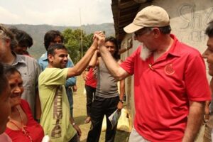 Residents of a village in Nepal celebrate the delivery of relief supplies (Baptist Press)