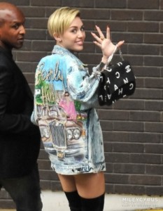 Miley Cyrus sports a now-vintage Tony Alamo jacket.