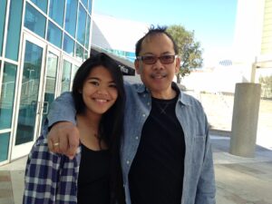 John Mira, with his daughter, Wisdom.