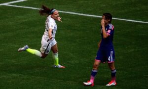 After her impossible goal, Holday celebrates.