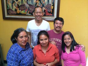 John Mira, ministering in Guatemala, with the family pastoral of the Iglesia Cristiana La Puerta.