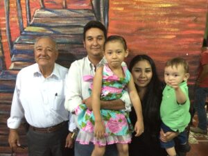 Ismael with his son Carlos, named after his beloved brother, with Carlos' family.