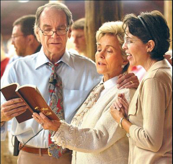 Dean with wife Lory and daughter Deanna sing "Victory in Jesus"