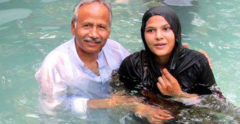Dr. Saleem Massey baptizing a new believer