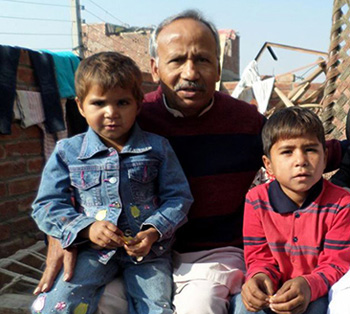 Dr. Saleem Massey with orphans whose parents were burned alive by radical Muslims