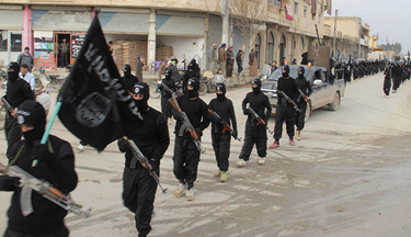 Fighters of al-Qaeda linked Islamic State of Iraq and the Levant parade at Syrian town of Tel Abyad