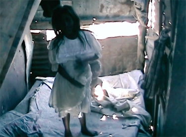 Interior of makeshift shelter at dump