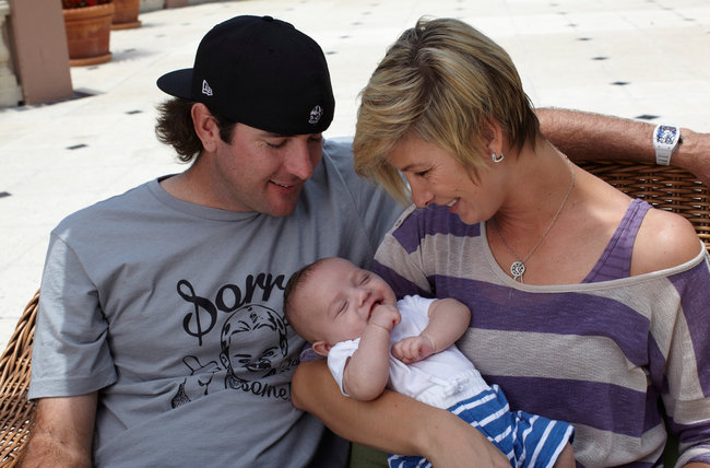 With his wife and first adopted child.