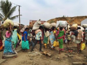 Rescued families gather their belongings 