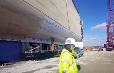 Ken Ham walks around exterior of ark