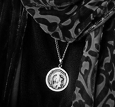 ancient goddess Athena medallion worn by Houston