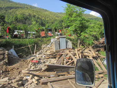 Buildings still lie in rubble