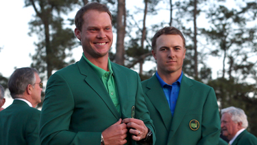 Danny stands next to Jordan after his win