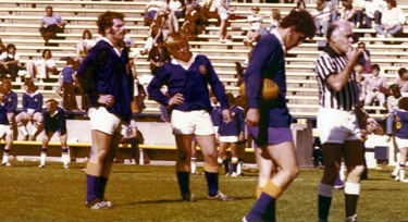 Playing rugby in college (second from left)