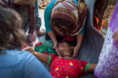 Women gather around to pray