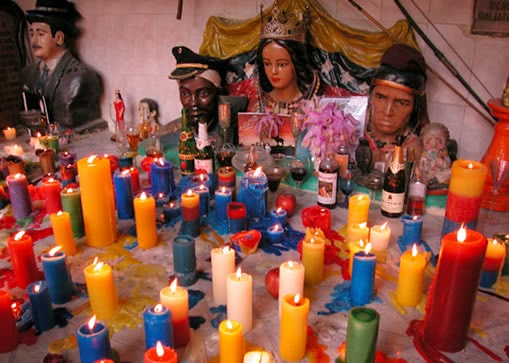 Candles in santeria practices. Image from Google.