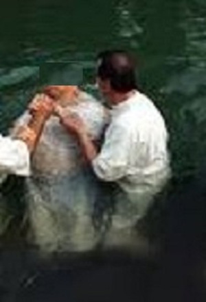 Pastor Paul baptizes one of the new Muslim converts to Christianity