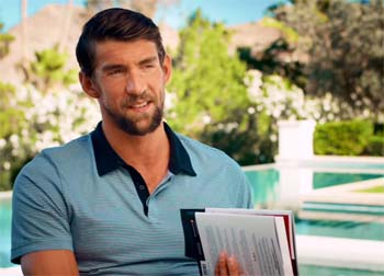 Michael Phelps holding copy of "The Purpose Driven Life".