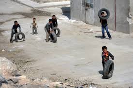 Kids from Aleppo bringing tires.