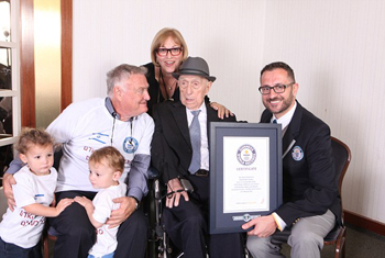 Marco Frigatti, Head of Records for Guinness World Records, presents Israel Kristal his certificate of achievement for Oldest living man on 11th March 2016, Haifa, Israel. Picture credit: Dvir Rosen/Guinness World Records From L-R: grandchildren Nevo and Omer, Heim Kristal (son), Shula Kuperstoch (daughter), Israel Kristal, Marco Frigatti