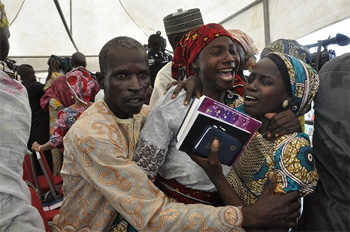 Parents overcome with emotion at release of their daughter from captivity