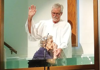 (Ophelia White, 94, is baptized at Cook Baptist Church in Ruston, La., by discipleship and administrative pastor Todd Free. Photo courtesy of the Baptist Message) 