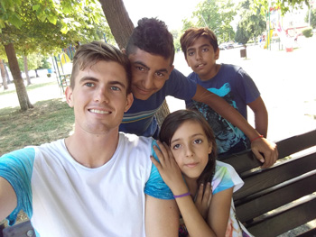 Billy with kids in Romania