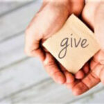 Two hands offering to give, donate or charity
